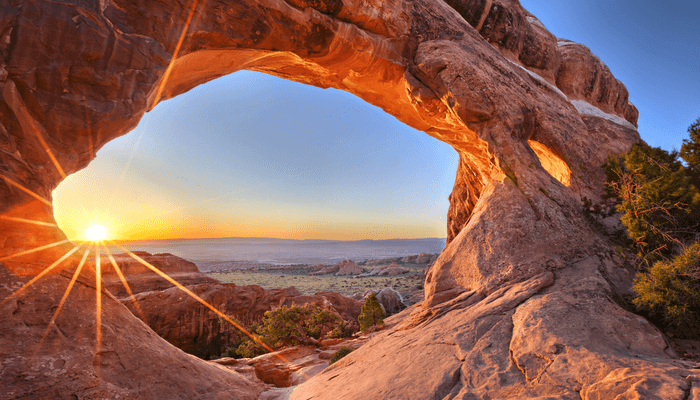 Image of the Arches view and the sun setting in the background