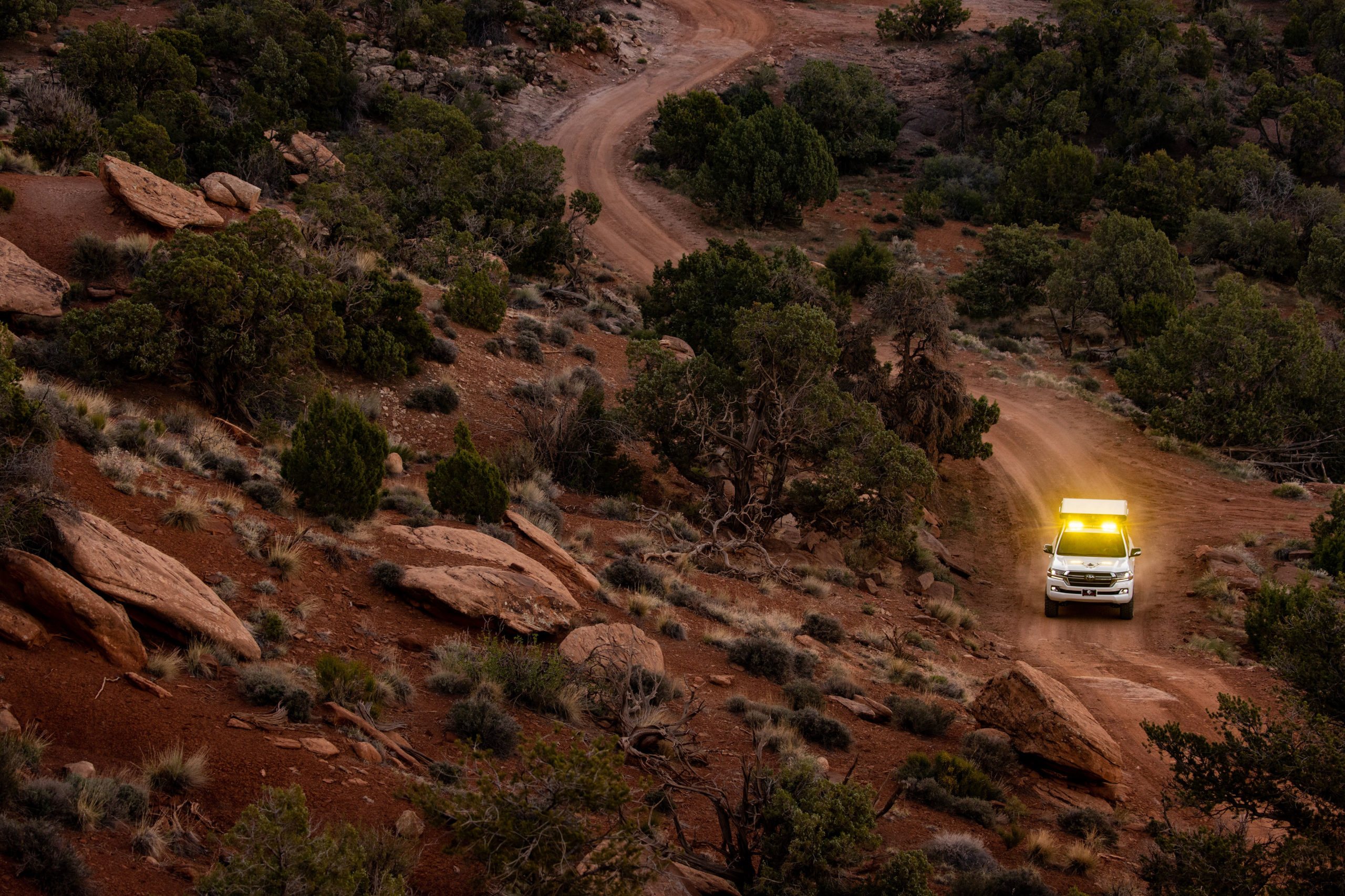 Image of a Colorado Overlander vehicle navigating a red dirt road