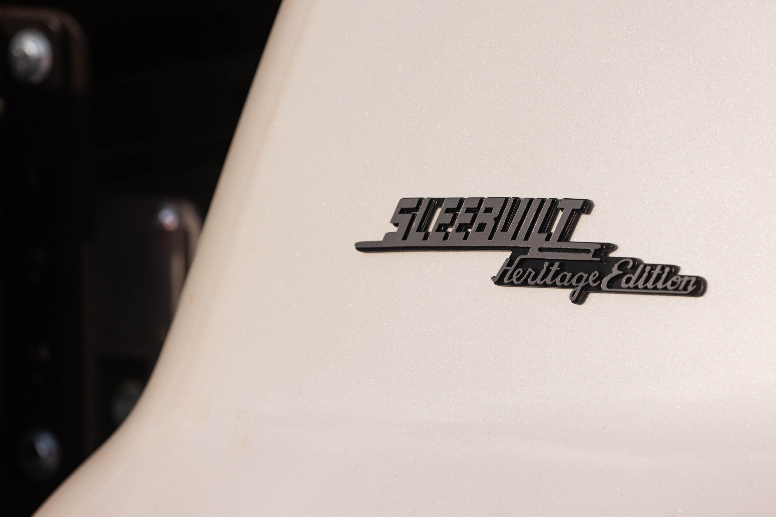 Image of the Sleebuilt Logo on the side of a Toyota
